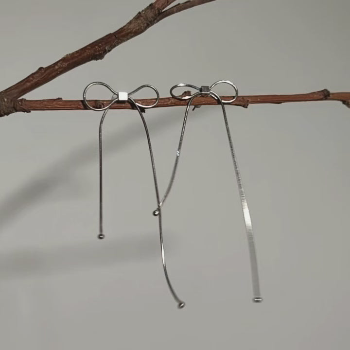 揺れるリボン シルバーの輝き レイヤードフリンジピアス